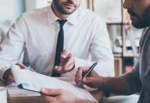 Does paying off outstanding debts automatically improve credit score?