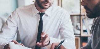 Does paying off outstanding debts automatically improve credit score?