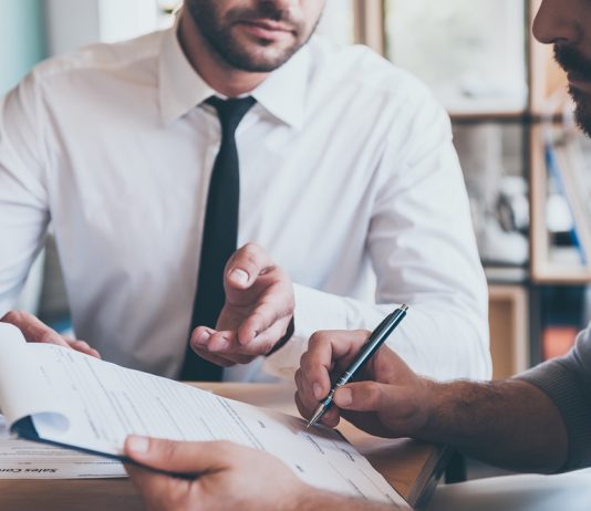 Does paying off outstanding debts automatically improve credit score?