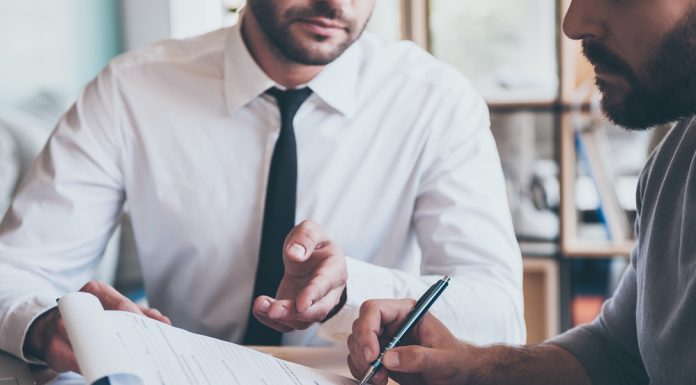 Does paying off outstanding debts automatically improve credit score?